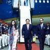 Le Premier ministre Pham Minh Chinh (au milieu) et son épouse arrivent à l'aéroport Las Americas, dans la capitale Saint-Domingue de la République dominicaine. Photo : VNA.