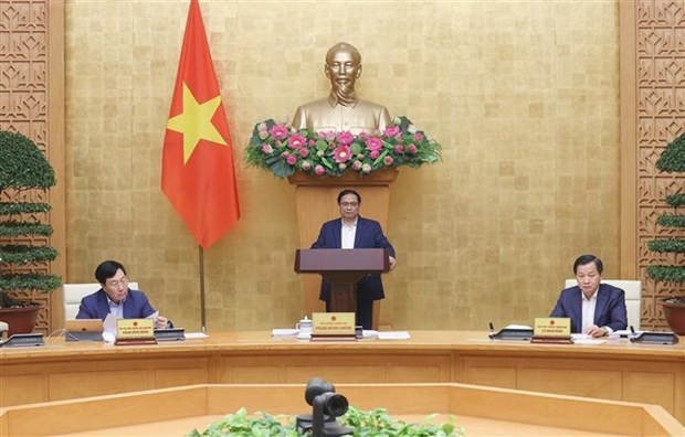 Le PM Pham Minh Chinh préside la réunion de décembre du gouvernement. Photo : VNA.