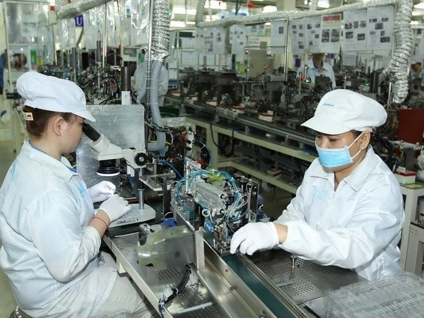 Production de composants électroniques chez Nidec Sankyo Vietnam, Hô Chi Minh-Ville. Photo d'illustration : VNA.