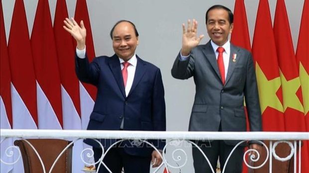 Le président vietnamien, Nguyên Xuân Phuc (à gauche) et son homologue indonésien, Joko Widodo. Photo : VNA.