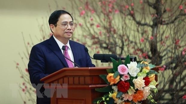 Le Premier ministre Pham Minh Chinh s'exprime lors de la rencontre. Photo: VNA