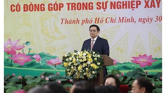 Le Premier ministre Pham Minh Chinh préside la conférence en l’honneur des organisations religieuses. Photo: VNA