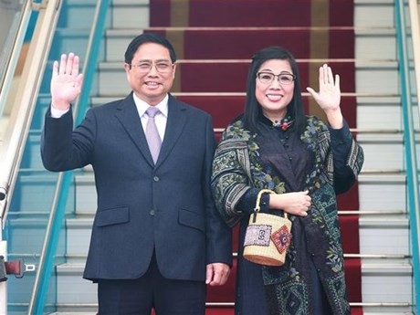 Le Premier ministre Pham Minh Chinh et son épouse. Photo : VNA.