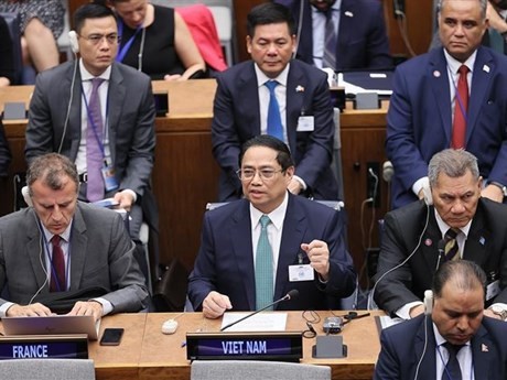 Le Premier ministre Pham Minh Chinh prend la parole lors du Sommet sur l’ambition climatique. Photo: VNA