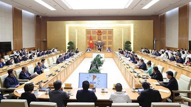 Rencontre entre le Premier ministre et les présidents, directeurs généraux des banques commerciales, le 16 octobre à Hanoi. Photo : VNA