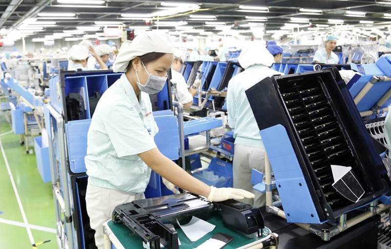 Dans l'usine de Canon Vietnam Co., Ltd - une entreprise à capitaux japonais, située à Hanoi. Photo : hanoimoi.com.vn