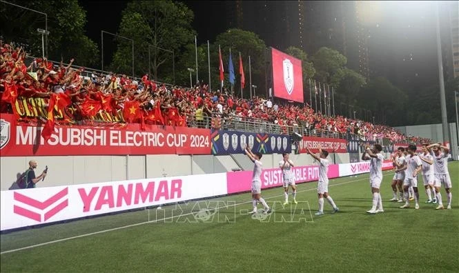 La joie de l'équipe vietnamienne à Singapour. Photo : VNA.