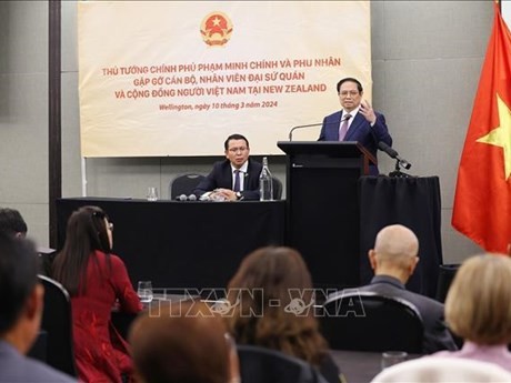 Le PM Pham Minh Chinh s’exprime lors de la rencontre avec la communauté vietnamienne en Nouvelle-Zélande. Photo : VNA.