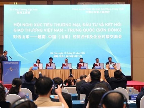 Conférence sur la promotion du commerce, de l’investissement entre le Vietnam et la province chinoise du Shandong. Photo : VNA.