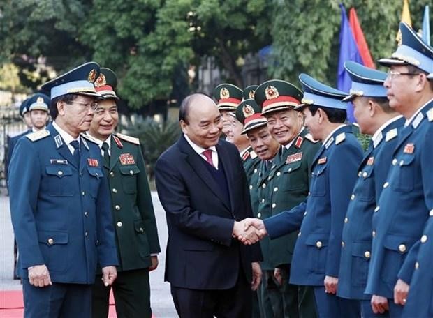 Le Président de la République, Nguyên Xuân Phuc, et des délégués de la rencontre. Photo : VNA. 