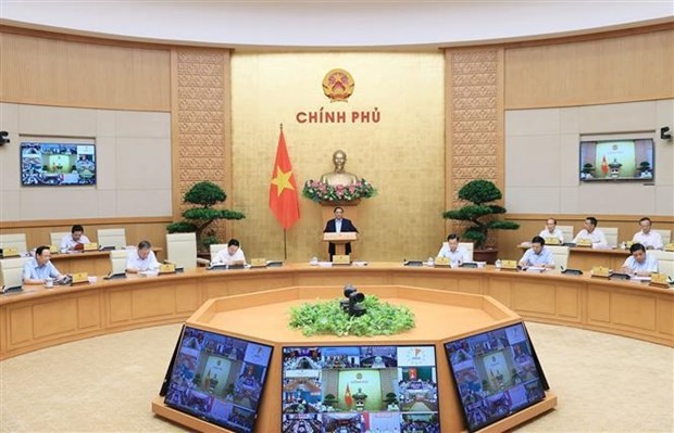 Visioconférence entre le Gouvernement et les localités et réunion périodique du Gouvernement tenues mardi 4 juillet à Hanoï. Photo : VNA.