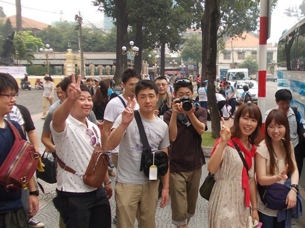 Des touristes japonais à Hô Chi Minh-Ville. Photo : VOV. 