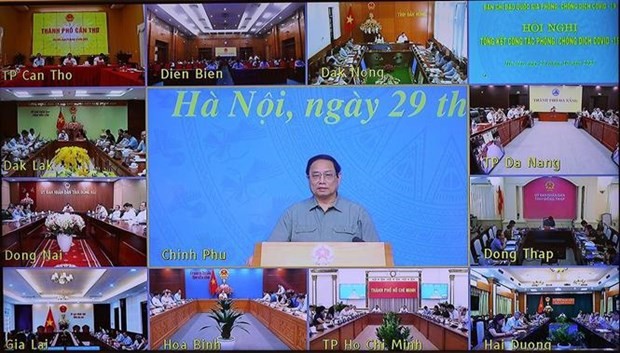 Le Premier ministre Pham Minh Chinh préside la conférence nationale sur le bilan des efforts contre l’épidémie, le 29 octobre. Photo: VNA