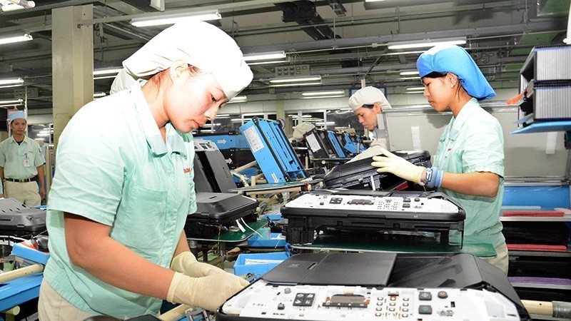 Fabrication de produits électroniques chez Canon Vietnam, dans le parc industriel de Thang Long, Hanoï. Photo : DANG ANH.