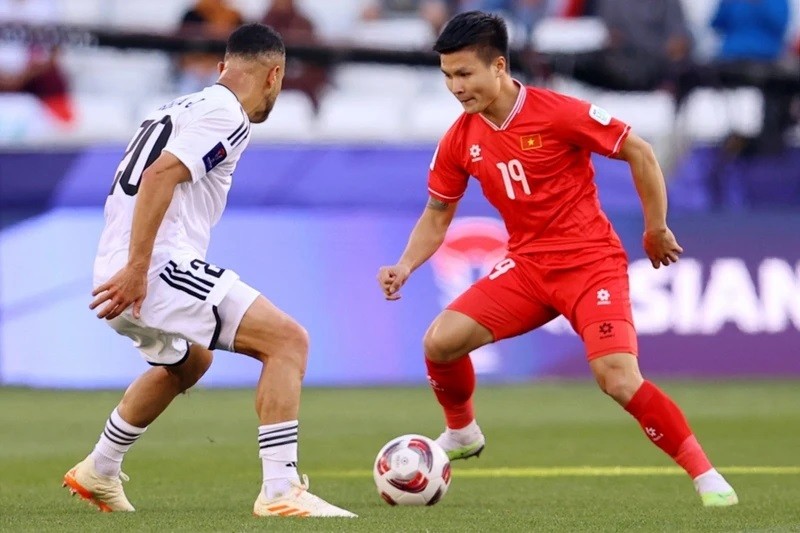 Nguyên Quang Hai a égalisé 2 - 2 pour le Vietnam. Photo : Reuters.