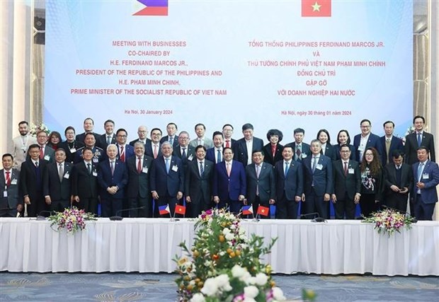  Le Premier ministre vietnamien Pham Minh Chinh et le Président philippin Ferdinand Romualdez Marcos Jr. ont co-présidé mardi après-midi, 30 janvier, une rencontre avec des entreprises typiques du Vietnam et des Philippines. Photo : VNA.