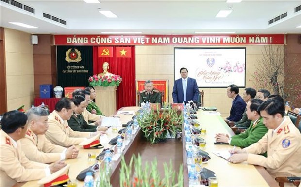 Le Premier ministre Pham Minh Chinh lors d'une séance de travail avec le Département de la police de la circulation du ministère de la Sécurité publique. Photo : VNA.