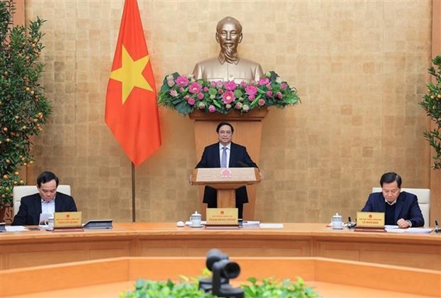 Le Premier ministre Pham Minh Chinh (debout) lors de la réunion. Photo : VNA.