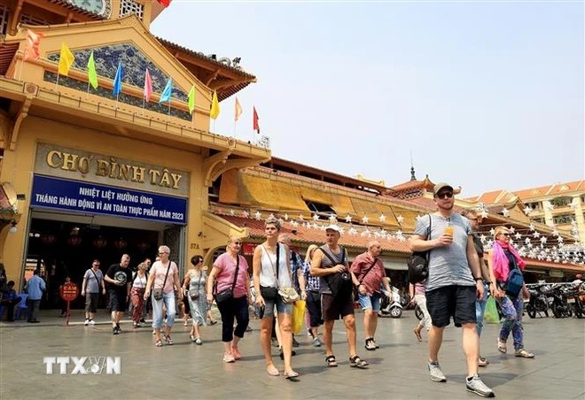 Touristes à Hô Chi Minh-Ville. Photo : VNA.