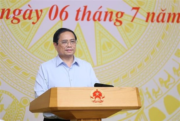 Le Premier ministre Pham Minh Chinh s’exprimant lors de la réunion à Hanoi, le 6 juillet. Photo : VNA. 