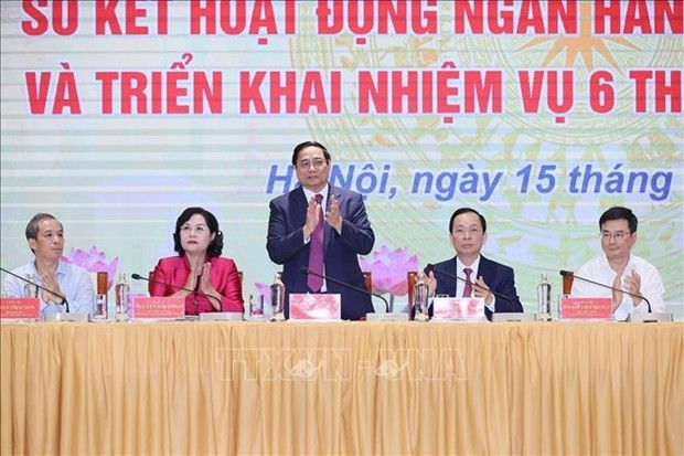 Le Premier ministre Pham Minh Chinh assiste ce samedi matin à une conférence du secteur bancaire. Photo : VNA