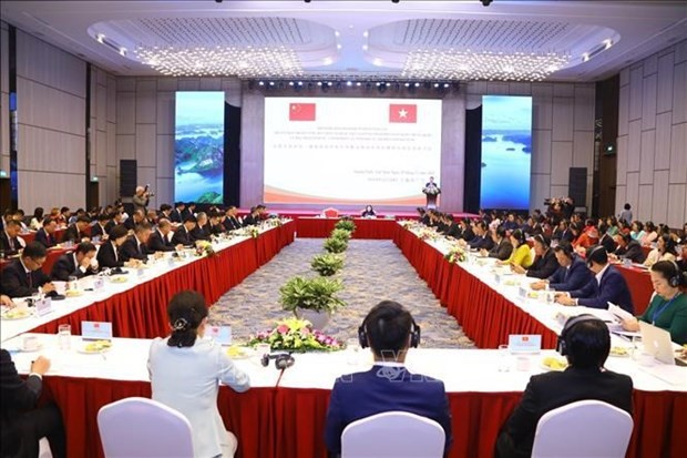 La conférence pour échanger des expériences sur le travail du Front entre le Vietnam et la Chine. Photo : VNA.