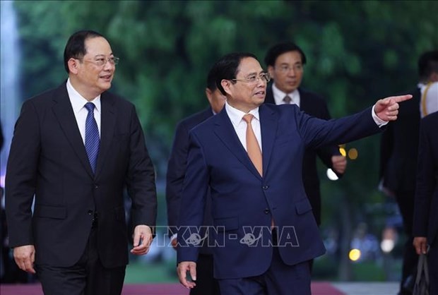  Le Premier ministre vietnamien Pham Minh Chinh (droite) et son homologue lao Sonexay Siphandone. Photo : VNA.