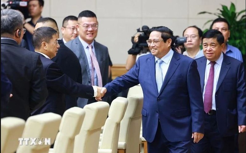 Le Premier ministre Pham Minh Chinh rencontre des entreprises chinoises. Photo : VNA.