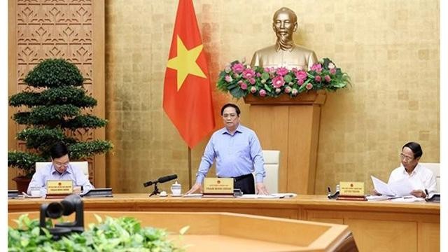 Le Premier ministre Pham Minh Chinh prend la parole lors de la réunion périodique d'août du gouvernement. Photo : VNA.