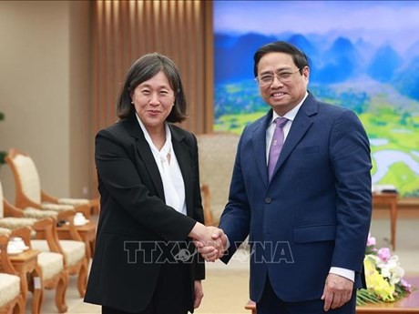 Le Premier ministre Pham Minh Chinh et la représentante américaine au commerce Katherine Tai. Photo : VNA.