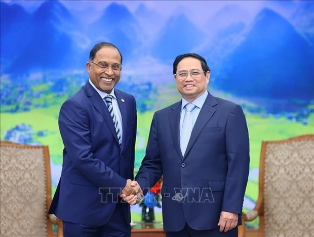 Le Premier ministre vietnamien, Pham Minh Chinh (à droite), a reçu le 19 juillet à Hanoï le ministre malaisien des Affaires étrangères, le sénateur Zambry Abdul Kadir. Photo : VNA.