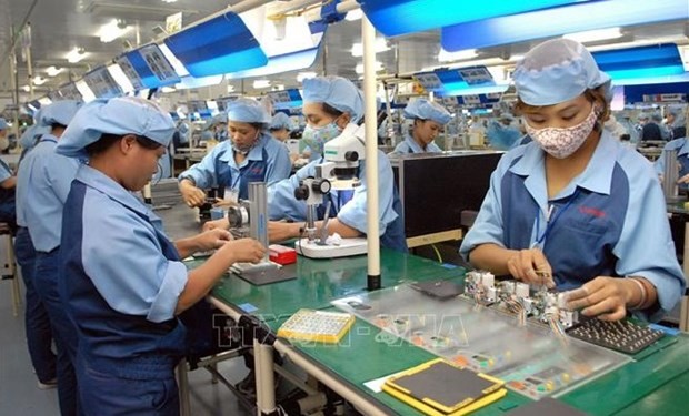 Production des composants électroniques chez Canon Electronics Co., Ltd.Photo: VNA