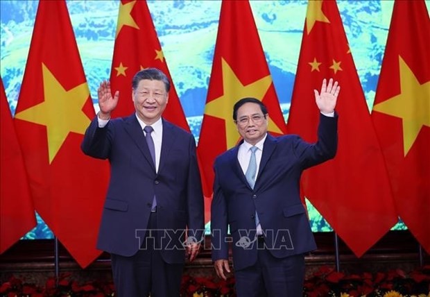 Le Premier ministre de la République socialiste du Vietnam, Pham Minh Chinh (à droite), et le Secrétaire général du Comité central du Parti communiste chinois (PCC) et Président de la République populaire de Chine, Xi Jinping. Photo : VNA.