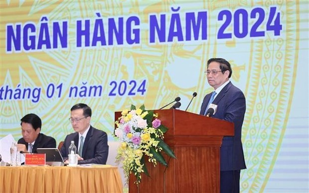 Le Premier ministre Pham Minh Chinh s'exprimant lors de la conférence sur le déploiement des tâches du secteur bancaire pour 2024. Photo : VNA. 