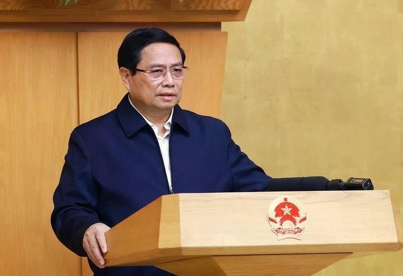 Le Premier ministre Pham Minh Chinh préside la réunion périodique de janvier du gouvernement. Photo : VNA. 