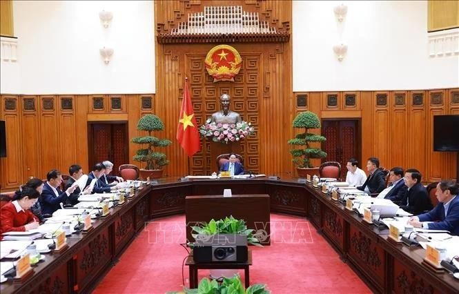 Le Premier ministre Pham Minh Chinh (centre) présidant la conférence du Comité du Parti du gouvernement, à Hanoi, le 5 mars. Photo: VNA 