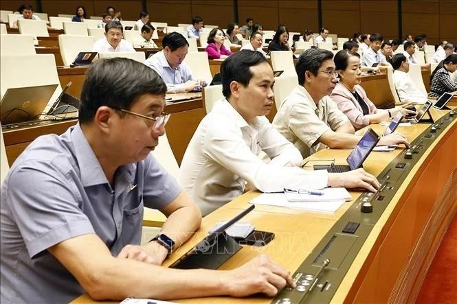 L'Assemblée nationale (AN) approuve la Résolution sur un certain nombre de mécanismes et de politiques spécifiques pour le développement du secteur économique privé. Photo : VNA. 