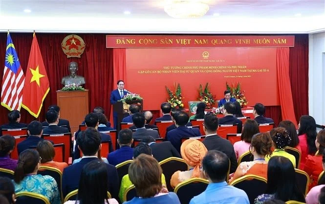 Le Premier ministre Pham Minh Chinh rencontre la communauté vietnamienne en Malaisie. Photo : VNA.