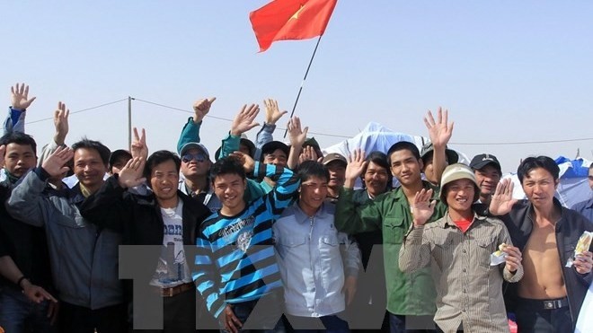 Travailleurs vietnamiens en Lybie. Photo: VNA.