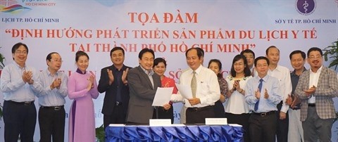 Cérémonie de signature d’une coopération entre le Service du tourisme de Hô Chi Minh-Ville et celui de la santé, le 16 juin dans la mégapole du Sud.Photo: VNA