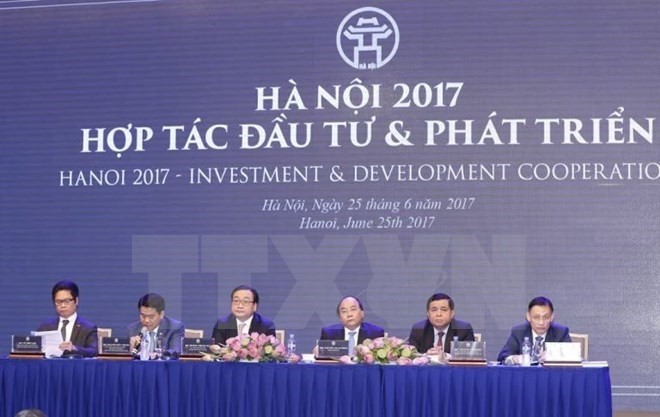 La conférence intitulée "Hanoi 2017 - Coopération, Investissement et Développement" a eu lieu dimanche, à Hanoi. Photo: VNA.