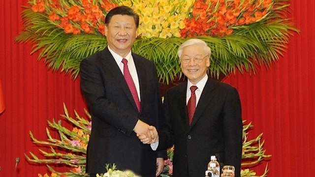 Le SG du PCV, Nguyên Phu Trong (à droite), et le SG du PCC et Président de la Chine, Xi Jinping. Photo : Trân Hai/NDEL.