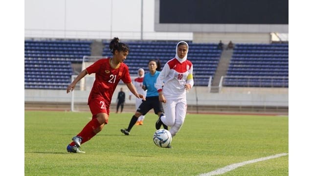 Le match entre l’équipe vietnamienne (maillot rouge) et l’équipe iranienne tenu le 7 mars.  Photo : VFF.