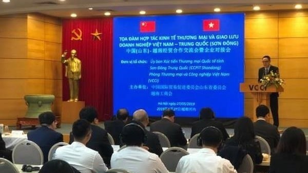 Forum d’affaires entre les entreprises vietnamiennes et celles du Shandong, le 27 mai à Hanoi. Photo: VNA.