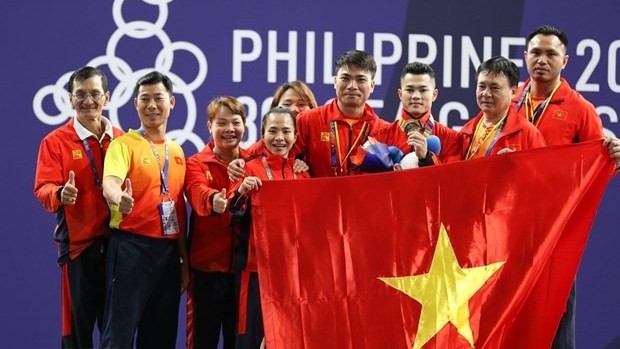 L'haltérophile Lai Gia Thanh remporte une médaille d'or dans la catégorie masculine des moins de 55 kg lors des SEA Games 30. Photo: VNA.