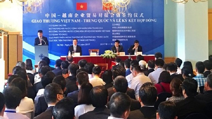 Une conférence de promotion commerciale entre les entreprises vietnamiennes et chinoises. Photo : CT.