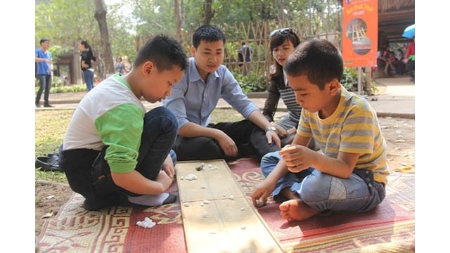 Le jeu du casier mandarin « ô an quan ». Photo d'illustration. VOV