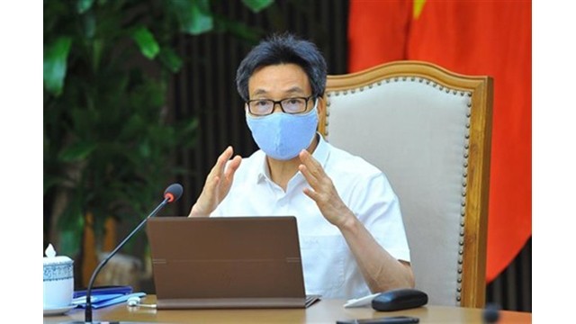 Le Vice-Premier ministre Vu Duc Dam s'exprime lors de l'événement, le 14 mai à Hanoï. Photo : VNA.