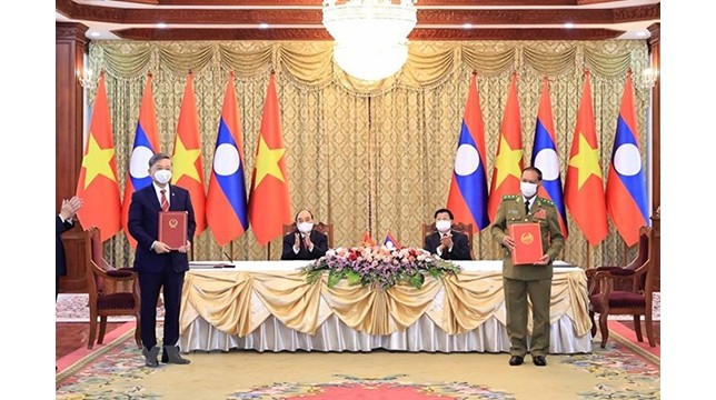 Cérémonie de signature du plan de coopération complémentaire en 2020 entre les deux ministères de la Sécurité Publique du Vietnam et du Laos. Photo : VNA.