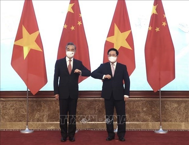 Le Vice-Premier ministre permanent vietnamien, Pham Binh Minh (à droite), et le ministre chinois des Affaires étrangères Wang Yi.  Photo : VNA.
